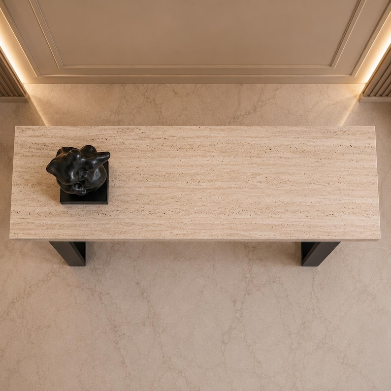 Modern sofa table featuring rectangular travertine top and black steel legs
Elegant entryway console table crafted from authentic beige travertine
Contemporary stone console table with luxury hallway styling