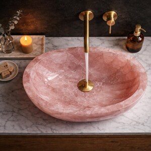 Handmade rose quartz stone vessel sink top view showing natural crystal patterns and polished pink finish