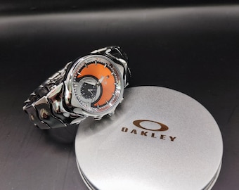 Reloj Oakley estilo Hollow Point: reloj de pulsera de coleccionista con esfera naranja futurista estilo Y2K.