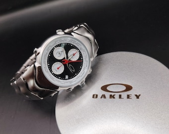 Reloj Oakley estilo GMT: reloj de colección futurista con esfera negra y hora mundial, estilo Y2K.