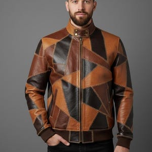 May include: A brown leather jacket with a patchwork design. The jacket features a stand-up collar, a front zipper, and ribbed cuffs and hem. The jacket's color palette includes shades of brown and black.