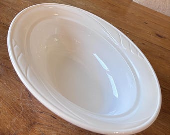 Corning Ware Casual Elegance oval casserole dish in the White Floral pattern.