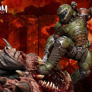 May include: A detailed action figure diorama featuring a green armored character stomping on a monster with sharp teeth. The background is a fiery red with the word "DOOM" in white. The figure is in a dynamic pose, suggesting combat.