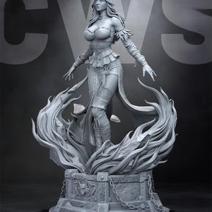 May include: A gray statue of a woman with long hair, wearing a detailed outfit, standing on a pedestal with flames. The statue has outstretched arms and is surrounded by stylized flames, with intricate details.