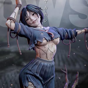 May include: A detailed sculpture of a female figure with a cracked, porcelain-like appearance. She wears a torn blue school uniform and is bound with rope. The figure has dark hair and a subtle, unsettling smile. Japanese text is visible in the background.
