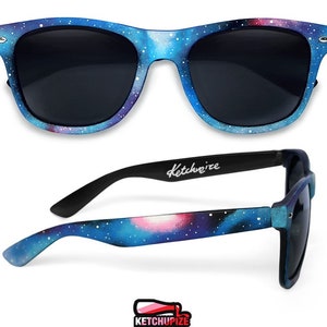 Picture of black sunglasses, hand-painted with a galaxy design in blue, purple and pink colors.