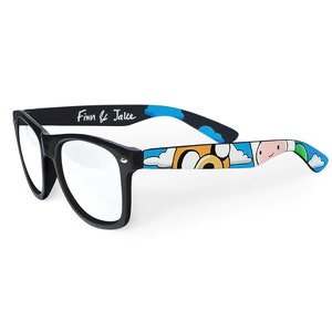 Picture of black clear lens glasses, hand-painted with an Adventure Time inspired design, including Finn the human and Jake the dog on a blue background with white clouds, in white, blue and yellow colors.