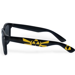 Picture of black sunglasses, hand-painted with a Legend of Zelda inspired design, including yellow triforce and wingcrest, in black and yellow colors.