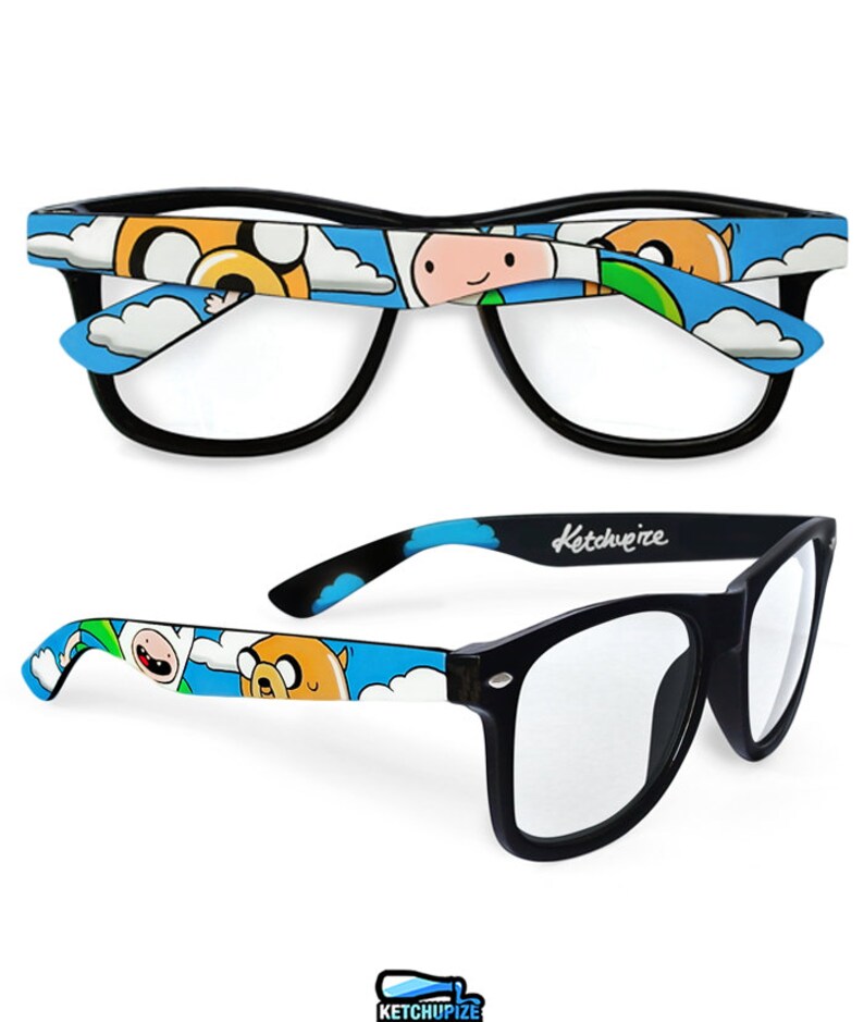 Picture of black clear lens glasses, hand-painted with an Adventure Time inspired design, including Finn the human and Jake the dog on a blue background with white clouds, in white, blue and yellow colors.