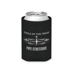May include: Black can cooler with the text "TOOLS OF THE TRADE" and "PIPE STRETCHER" in white. A silver can sits inside the cooler. A graphic of a pipe stretcher is in the center of the cooler.