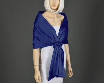 May include: A navy blue satin shawl with a simple design. The shawl is draped over a mannequin's shoulders and tied at the waist.