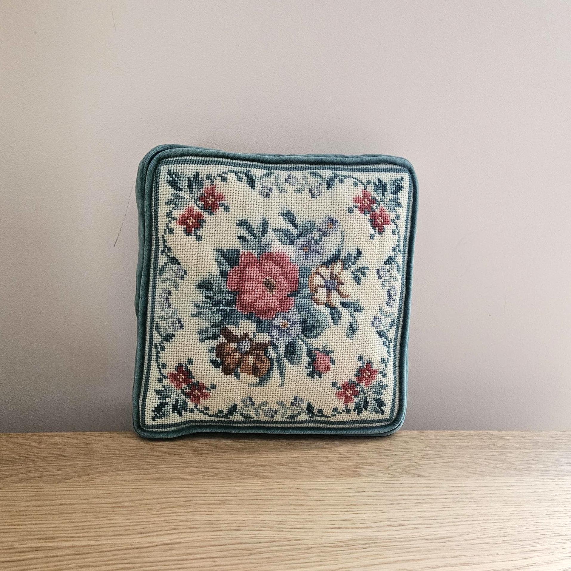 Lot - A group of tapestry and petit point throw pillows