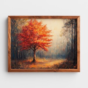 May include: A framed landscape painting depicts a vibrant autumn scene. A tree with fiery red and orange leaves stands prominently in the center, surrounded by a misty forest. The artwork is encased in a wooden frame.