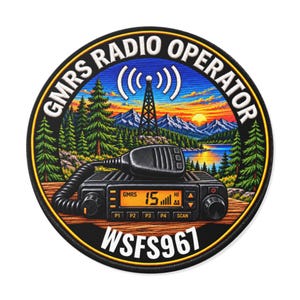 May include: A circular patch featuring a GMRS radio with a microphone, set against a landscape of pine trees, mountains, and a sunset. The text GMRS RADIO OPERATOR is arched at the top, and WSFS967 is printed at the bottom in white.