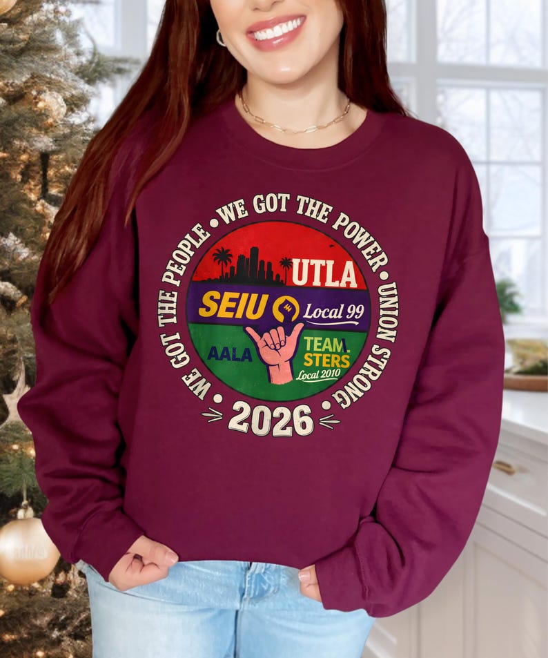 May include: Burgundy sweatshirt with a circular graphic. The graphic includes text that reads "WE GOT THE POWER" and "UNION STRONG". It also features the text "UTLA", "SEIU Local 99", "AALA", "TEAM STERS Local 2010", and "2026".
