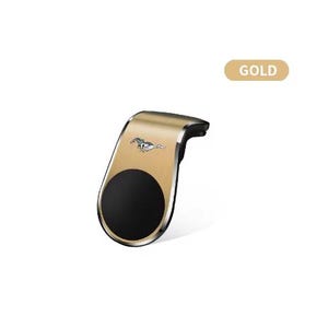 Pode incluir: Suporte de telefone para carro dourado com base magnética circular preta. O suporte apresenta um emblema prateado de um cavalo a correr e a palavra "GOLD" num retângulo bege.