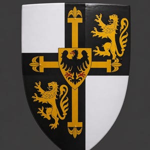 May include: A medieval-style shield with a black, white, and gold design. The shield features a cross with a central emblem of a black eagle on a gold background. Two gold lions and two white sections complete the design.