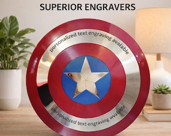 May include: A red, white, and blue shield with a silver trim and a large star in the center. The shield has the text "Personalized text engraving available" and "SUPERIOR ENGRAVERS".