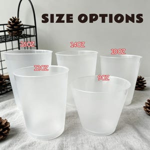 May include: A selection of frosted white plastic cups, each labelled with its fluid ounce capacity: 9oz, 10oz, 12oz, 14oz, and 16oz. The text "SIZE OPTIONS" is displayed above the cups. The cups are arranged on a light-coloured surface.