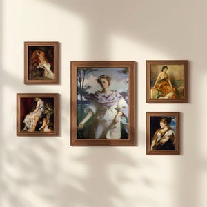 May include: Five framed classical art prints in wooden frames are displayed on a cream-colored wall. The art features portraits of women in various poses and settings, with a focus on soft colors and classical themes.