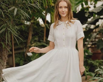 Vestido clássico de linho com gola Peter Pan e mangas curtas, cor branco magnólia.