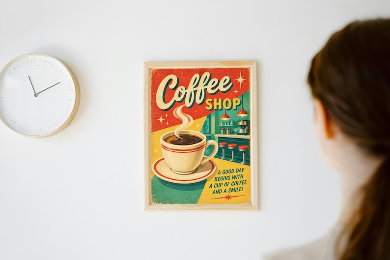 May include: A framed rectangular wall poster featuring a graphic illustration of a steaming cup of coffee on a saucer. The text reads Coffee SHOP and A GOOD DAY BEGINS WITH A CUP OF COFFEE AND A SMILE! The background shows a diner interior.