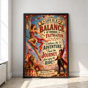 May include: A framed circus-themed poster featuring a trapeze artist and a ringmaster with a lion. The text reads: LIFE IS A BALANCE OF COURAGE, FAITH & FUN. Embrace the ADVENTURE. Trust the JOURNEY. And enjoy the RIDE! The best view comes after the hardest climb.
