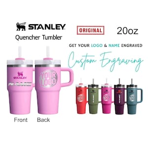 May include: Pink Stanley Quencher Tumbler with a handle and straw. The tumbler has the Stanley logo and the text "NAME" on the front. The back of the tumbler has the text "YOUR LOGO". Additional tumblers in red, green, pink, purple, and teal are also shown.