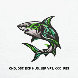 May include: Embroidered shark design in black, gray, and green. The shark has sharp teeth and a detailed fin. The design includes the text "CND, DST, EXP, HUS, JEF, VP3, XXX, PES".