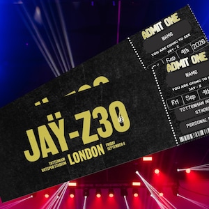 以下が含まれることがあります： 金色の文字でJAY-Z 30、トッテナム・ホットスパー・スタジアム、2026年9月4日金曜日と記された2枚の黒いコンサートチケット。チケットには名前、個人的なメッセージ、バーコードのグラフィックを記入する欄が含まれています。