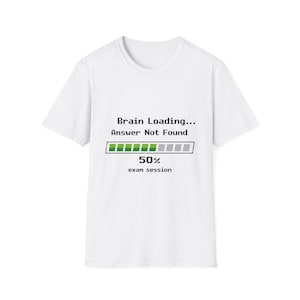 May include: A white short-sleeved t-shirt featuring a black pixelated graphic that reads Brain Loading... Answer Not Found. Below the text is a progress bar filled to 50 percent with green blocks, followed by the text 50% and exam session.