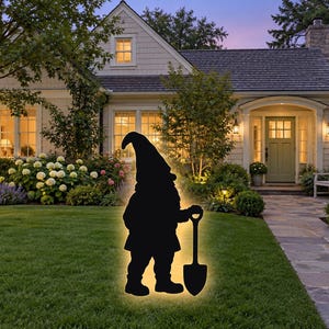 May include: A black silhouette of a garden gnome standing on a lawn, holding a shovel. The gnome figure features a glowing yellow outline that illuminates its shape against the dark silhouette, creating a bright border effect.