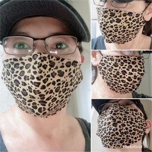 May include: A collage of three images showing a person wearing a brown and black leopard print face mask. The mask is made of fabric and has a pleated design. The person is wearing glasses in each image.