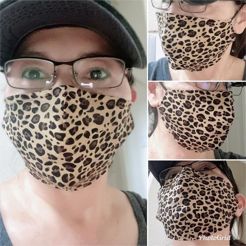May include: A collage of three images showing a person wearing a brown and black leopard print face mask. The mask is made of fabric and has a pleated design. The person is wearing glasses in each image.