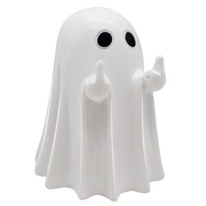 May include: A white ceramic ghost figurine with black eyes and raised arms, each hand displaying a middle finger. The ghost has a draped sheet-like form, creating a playful and irreverent decorative item.