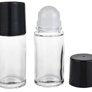May include: Clear glass roll-on bottles with black and white caps. One bottle has a black cap, another has a white rollerball top, and the third has a black cap. These bottles are suitable for essential oils, perfumes, or other cosmetic products.