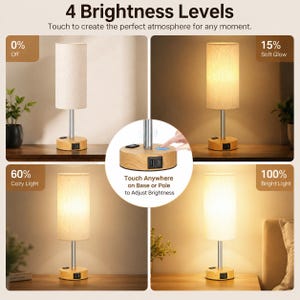 May include: A table lamp with a cylindrical fabric shade, a silver metal pole, and a light wood-grain base featuring a USB port. The lamp displays 4 brightness levels: 0% off, 15% soft glow, 60% cosy light, and 100% bright light, with touch control.