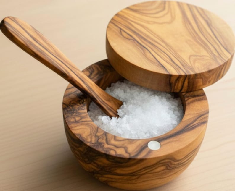 Handmade ceramic salt cellar with wooden spoon