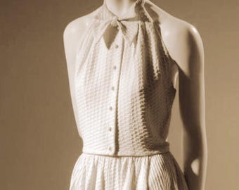 1951 Piqué ensemble sewing pattern. With halter collar buttoned top and bias sides full skirt. McCardell design.