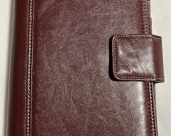 Agenda/planificador de cuero Franklin Covey de 7 anillas, incluye recambios, color burdeos.