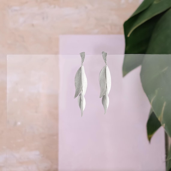 Statement leaf-like Silver stud earrings, also available in Gold and Gold with Black