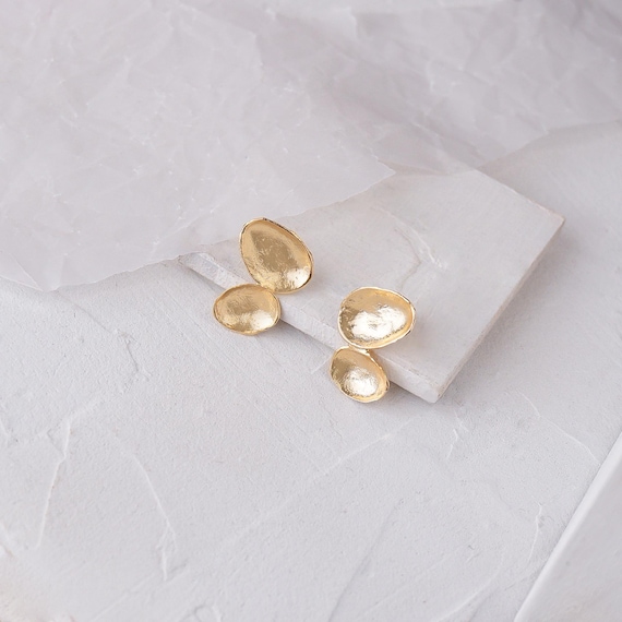 Shell like Golden stud earrings, also available in Silver and Clip-On