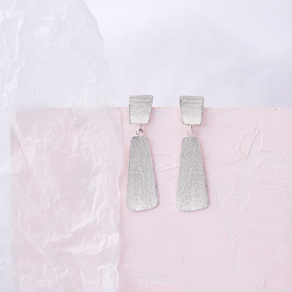 Dangling Silver stud earrings, also available in Gold and as Clip On