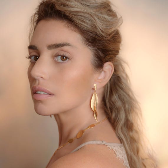Statement leaf-like Gold stud earrings, also available in Silver and Gold with Black