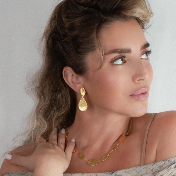 Elegant Gold teardrop stud earrings, also available in Silver