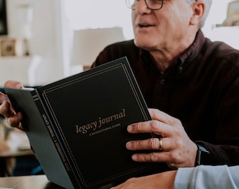 May include: A black hardcover journal with gold lettering that reads "Legacy Journal: A Generational Story".