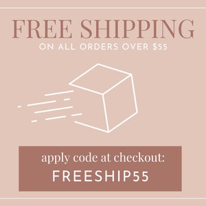 May include: A pink and white graphic with the text "FREE SHIPPING ON ALL ORDERS OVER $55". A white line drawing of a cube with lines extending from it, symbolizing shipping. The text "apply code at checkout: FREESHIP55" is in a brown rectangle.