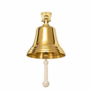 May include: A polished gold-colored brass bell featuring a smooth, flared body and a sturdy mounting bracket at the top. A thick, off-white braided rope lanyard with a knotted end hangs from the center clapper, providing a functional grip.