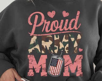 May include: A dark gray sweatshirt with a pink and camouflage print that says "Proud Army Mom" with a small American flag on a dog tag.
