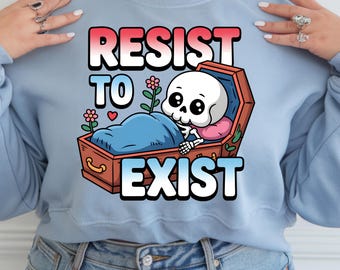 May include: Light blue sweatshirt with a graphic of a skeleton in a coffin with flowers and the text "Resist to Exist".